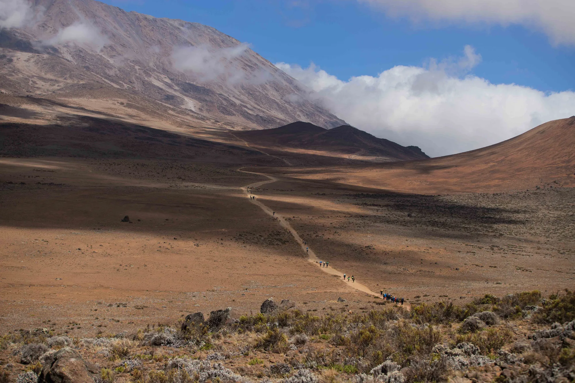 Trekkers approaching Mount Kilimanjaro on the Umbwe Route